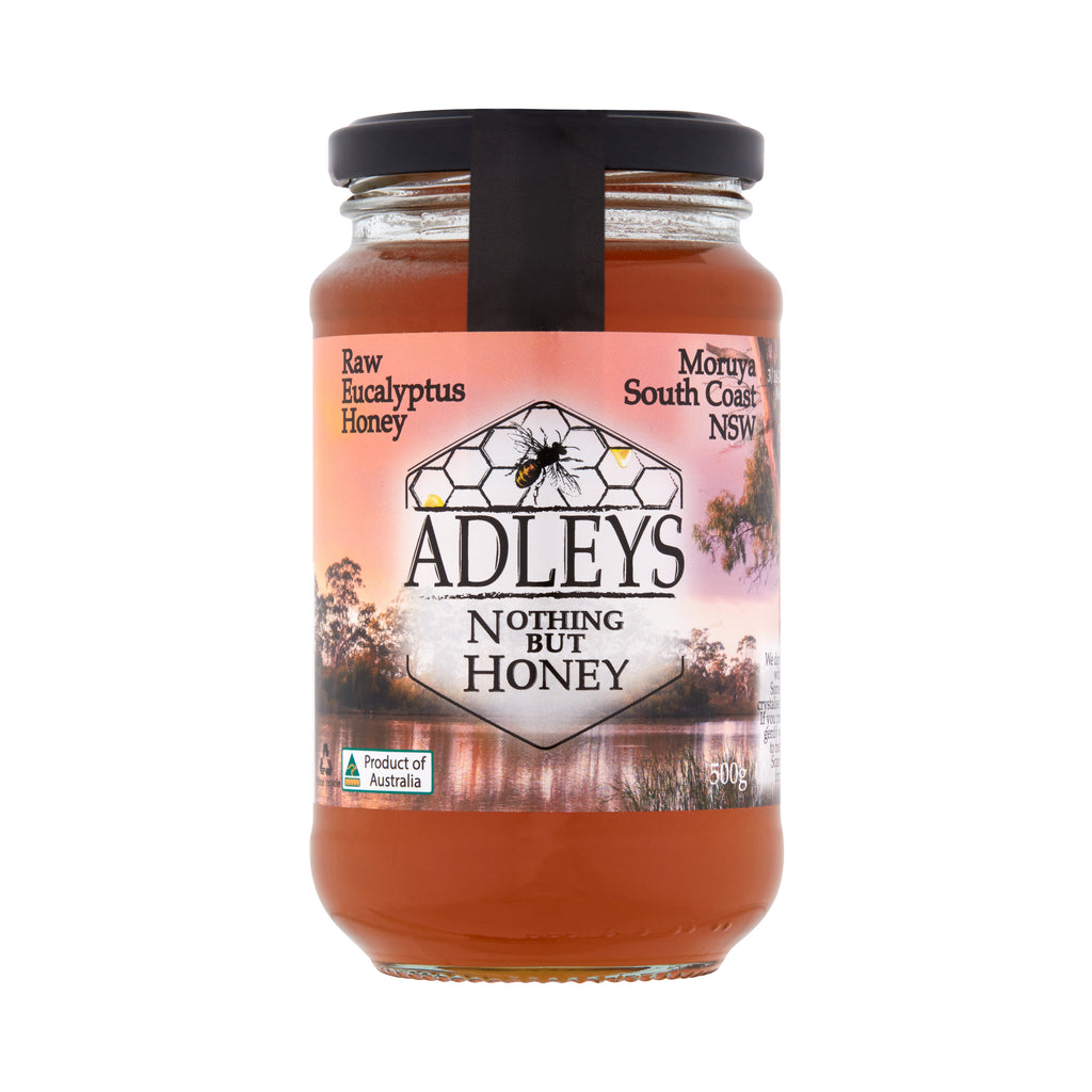 Jar of Adley's Raw Eucalyptus Honey with a scenic label on a white background